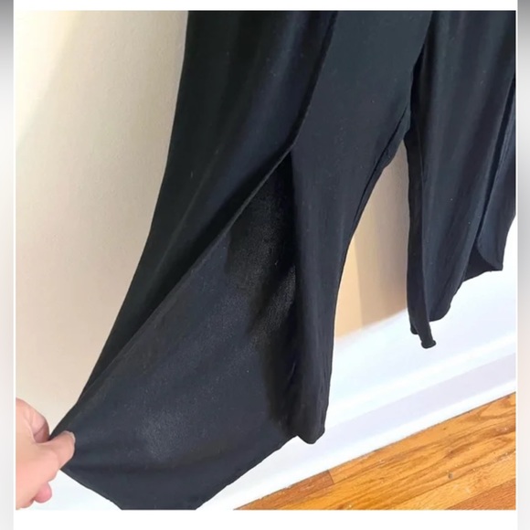 Melissa Nepton black off shoulder jumpsuit with flutter sleeves and tulip legs. - Picture 7 of 9